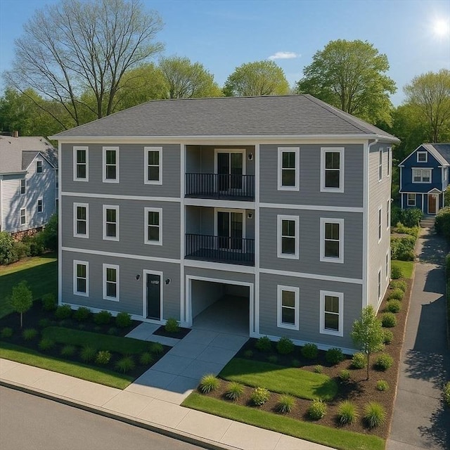 43-47 Fremont Unit 9, Boston, MA 02126 - view of building exterior featuring concrete driveway and a garage