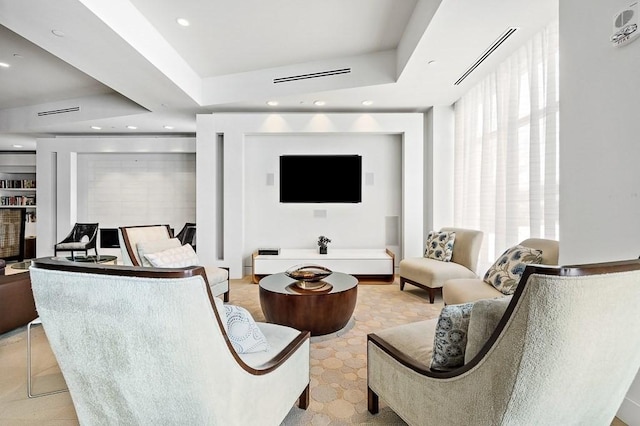 living room featuring a tray ceiling