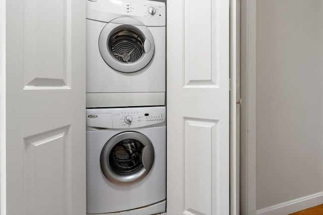 laundry area with stacked washer and clothes dryer