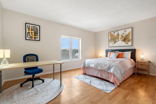 bedroom with light hardwood / wood-style floors