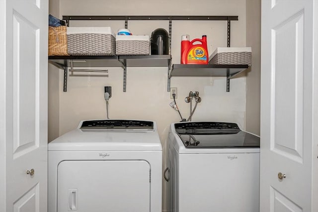 laundry room with washer and dryer and laundry area