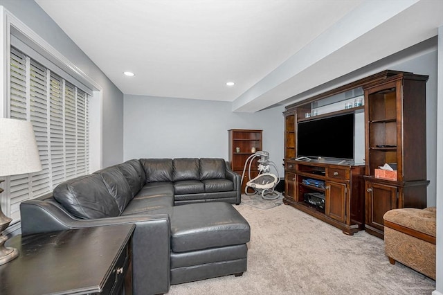 living room with recessed lighting and light carpet