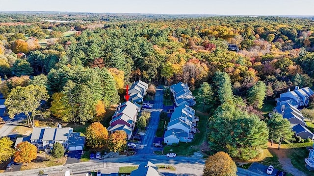 aerial view featuring a residential view and a wooded view