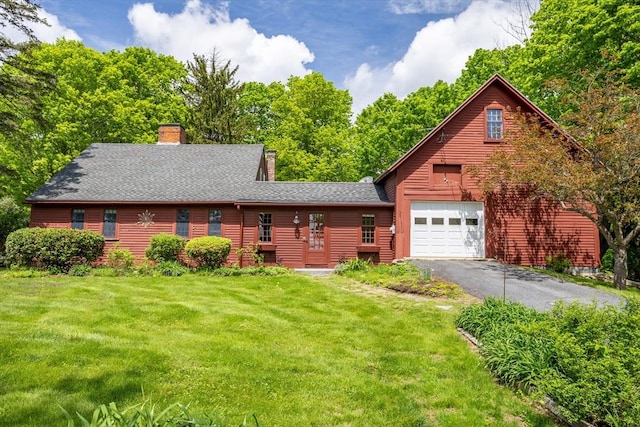 9 Eaton St, Gardner, MA 01440 - view of front facade featuring a chimney, a front lawn, roof with shingles, and driveway