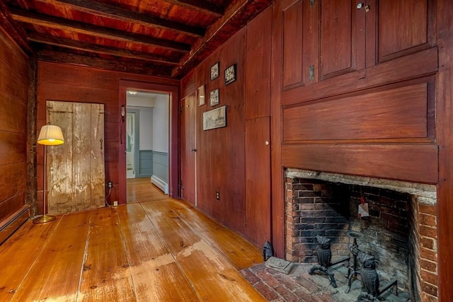 9 Eaton St, Gardner, MA 01440 - hallway with wooden ceiling, wood walls, beam ceiling, light wood finished floors, and baseboard heating