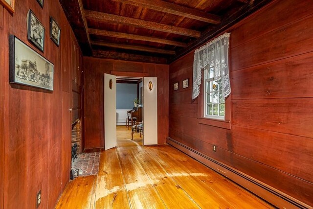 9 Eaton St, Gardner, MA 01440 - corridor with a baseboard radiator, wooden ceiling, hardwood / wood-style flooring, beamed ceiling, and wood walls