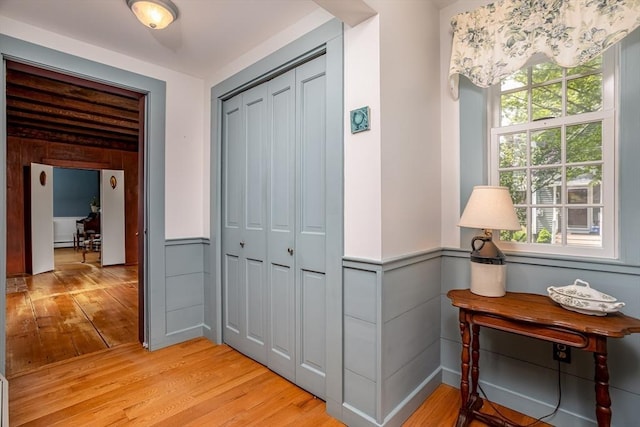 9 Eaton St, Gardner, MA 01440 - hallway with light wood-style flooring and wainscoting