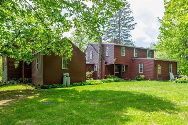 9 Eaton St, Gardner, MA 01440 - back of house featuring a lawn and a chimney