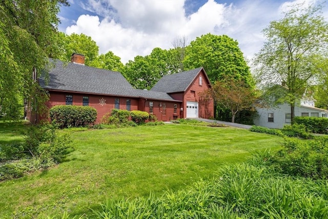 9 Eaton St, Gardner, MA 01440 - rear view of property featuring a garage, a lawn, a chimney, and roof with shingles