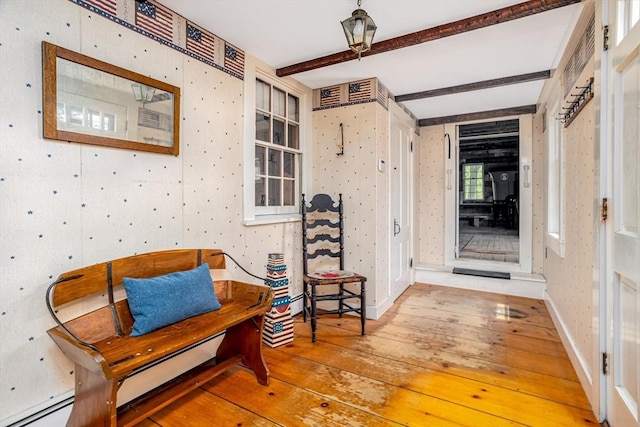 9 Eaton St, Gardner, MA 01440 - entrance foyer featuring hardwood / wood-style floors, beamed ceiling, wallpapered walls, baseboard heating, and baseboards