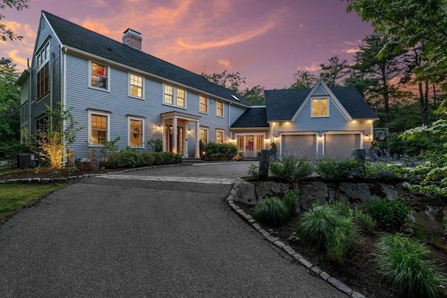 1 Crooked Ln, Manchester, MA 01944 - colonial home featuring driveway, a chimney, and a garage