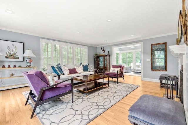 1 Crooked Ln, Manchester, MA 01944 - living area with light wood-style floors, ornamental molding, a fireplace, recessed lighting, and baseboard heating