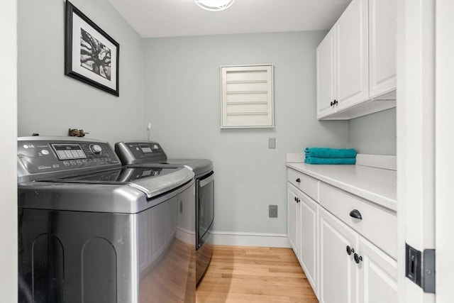 1 Crooked Ln, Manchester, MA 01944 - laundry area with separate washer and dryer, light wood-type flooring, and cabinet space