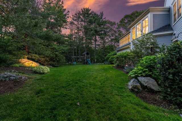 1 Crooked Ln, Manchester, MA 01944 - yard at dusk featuring a playground and a lawn