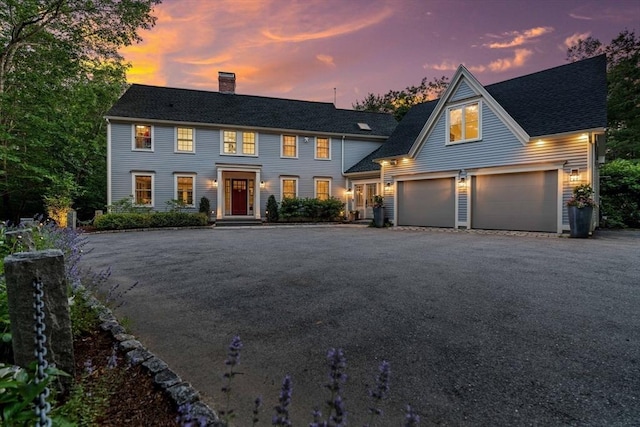 1 Crooked Ln, Manchester, MA 01944 - colonial-style house featuring a chimney, asphalt driveway, and a garage