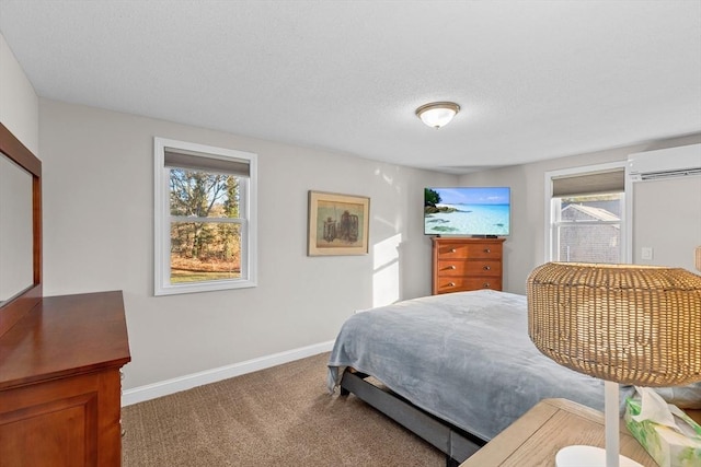 bedroom with carpet floors and a wall mounted AC