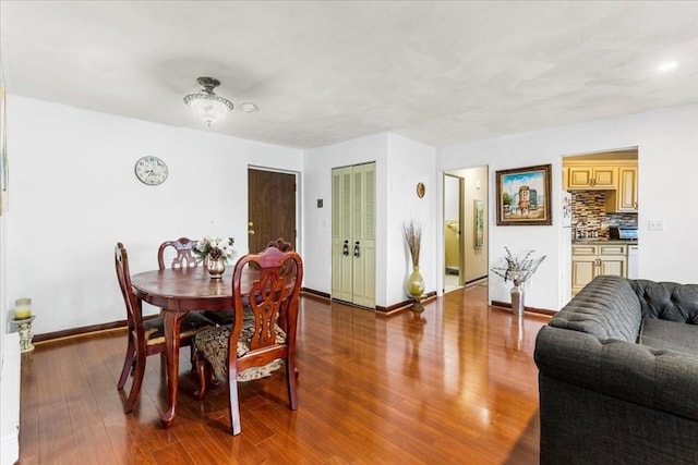 215 Thomas Burgin Pkwy Unit H13, Quincy, MA 02169 - dining space featuring baseboards and wood finished floors