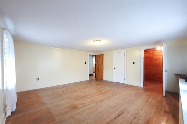 unfurnished bedroom with light wood-style flooring