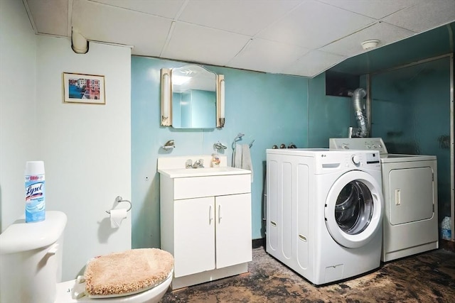 laundry area featuring laundry area, a sink, and separate washer and dryer