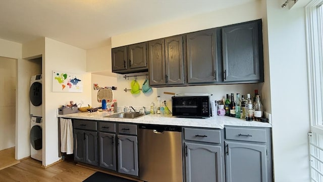 66 Winchester St Phb, Phb, Brookline, MA 02446 - kitchen featuring dishwasher, stacked washer and clothes dryer, a sink, light wood-type flooring, and black microwave