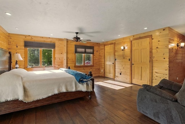 4 Paddock Rd, Rutland, MA 01543 - bedroom with wood walls, dark wood-style floors, and recessed lighting