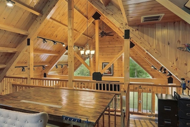 4 Paddock Rd, Rutland, MA 01543 - dining space featuring rail lighting, wood ceiling, wooden walls, and a chandelier