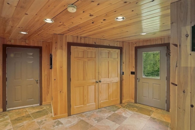 4 Paddock Rd, Rutland, MA 01543 - foyer with stone tile flooring, wooden ceiling, recessed lighting, wood walls, and baseboards