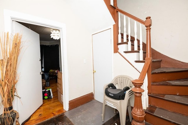 staircase featuring hardwood / wood-style floors