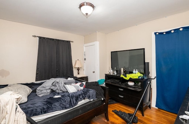 bedroom with wood-type flooring