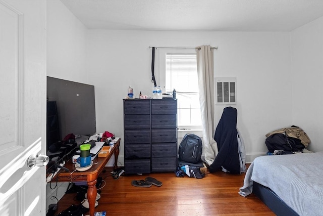 bedroom featuring hardwood / wood-style floors