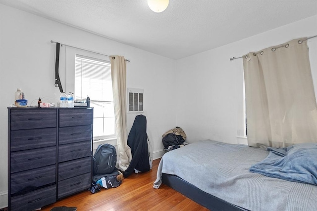 bedroom featuring hardwood / wood-style flooring