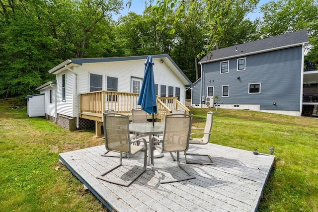 35 Island Rd, Holland, MA 01521 - back of property featuring a wooden deck, outdoor dining area, and a lawn