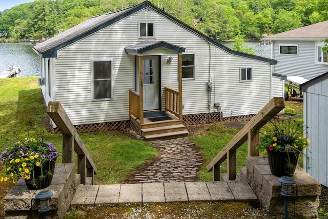 35 Island Rd, Holland, MA 01521 - view of front facade with a forest view, a water view, and a front yard