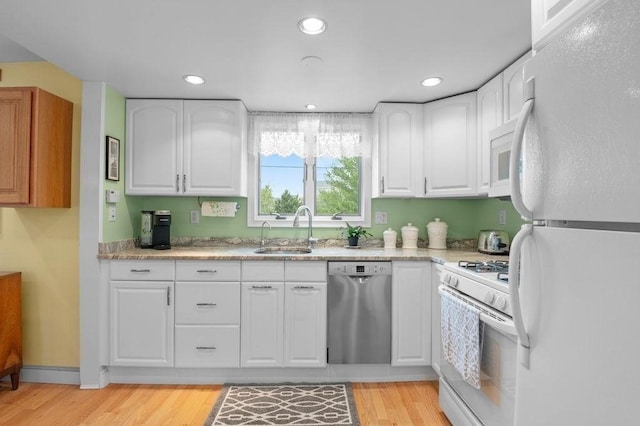 5 I St Unit 2, Newburyport, MA 01950 - kitchen with white appliances, white cabinetry, light wood-style floors, recessed lighting, and light stone countertops