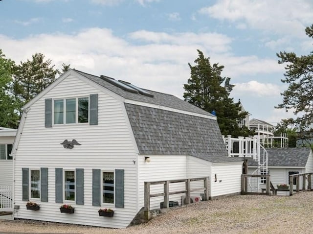 5 I St Unit 2, Newburyport, MA 01950 - back of house featuring a gambrel roof and roof with shingles