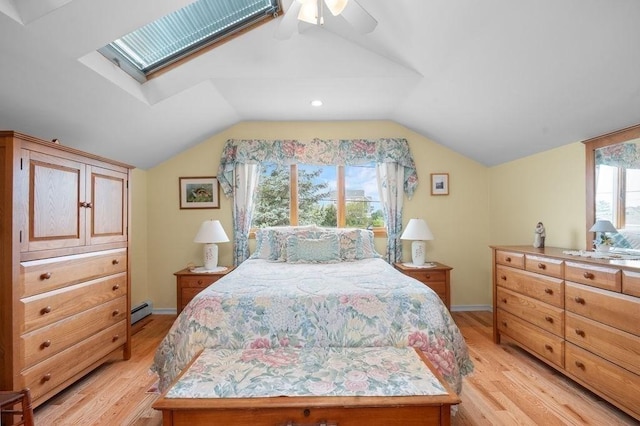 5 I St Unit 2, Newburyport, MA 01950 - bedroom featuring baseboard heating, light wood finished floors, vaulted ceiling, ceiling fan, and a skylight