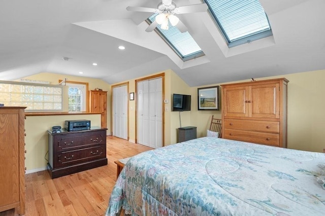 5 I St Unit 2, Newburyport, MA 01950 - bedroom featuring lofted ceiling, a skylight, light wood-type flooring, two closets, and recessed lighting