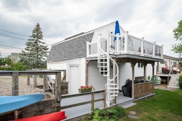 5 I St Unit 2, Newburyport, MA 01950 - rear view of property featuring a shingled roof, a deck, a gambrel roof, and stairway