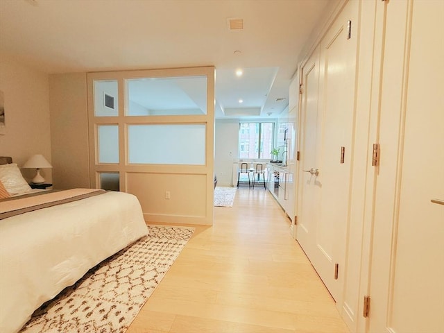 bedroom with light wood-type flooring