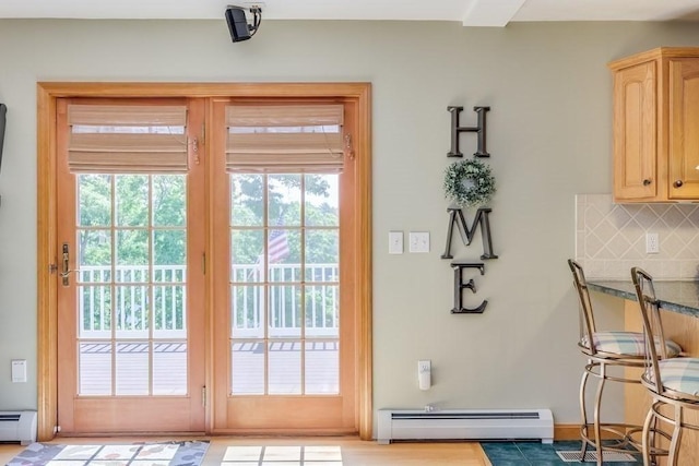 entryway with a baseboard radiator