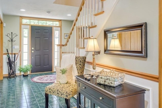 foyer with dark tile patterned flooring