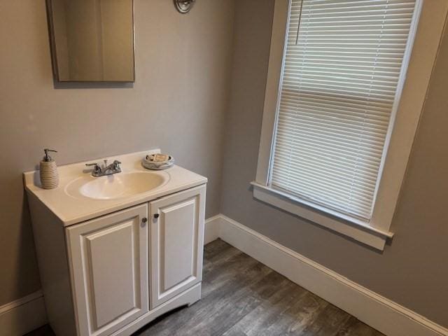 bathroom with vanity and hardwood / wood-style flooring