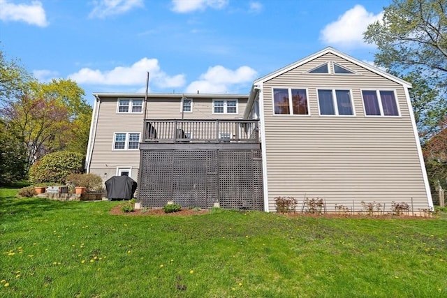 24 Hodgkins Dr, Ipswich, MA 01938 - rear view of property with a lawn and a deck