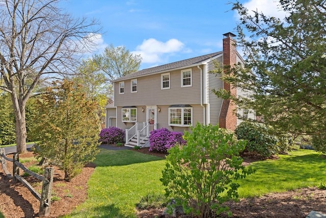 24 Hodgkins Dr, Ipswich, MA 01938 - view of front of house with a chimney and a front lawn