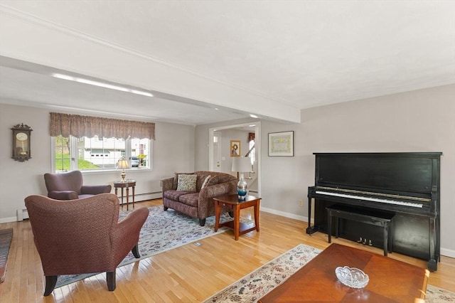 24 Hodgkins Dr, Ipswich, MA 01938 - living room featuring baseboards, a baseboard radiator, baseboard heating, and wood finished floors
