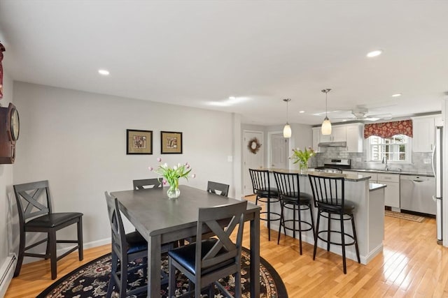 24 Hodgkins Dr, Ipswich, MA 01938 - dining room with light wood-style floors, recessed lighting, ceiling fan, and a baseboard heating unit