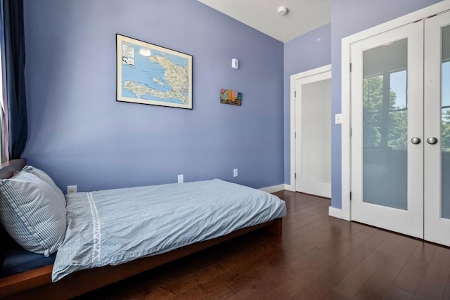370 Beech St Unit 2, Boston, MA 02131 - bedroom with french doors, dark wood finished floors, and baseboards