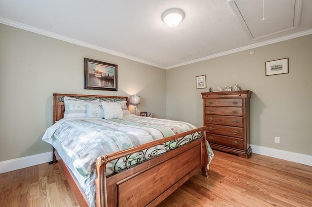 bedroom with light wood-type flooring and crown molding