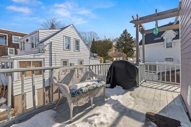 wooden terrace featuring a grill