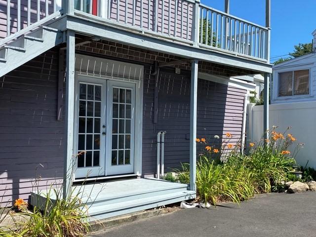 property entrance featuring french doors and a balcony